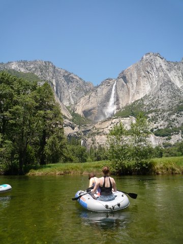Rafting on the Merced River in sight of Yosemite Falls, Yosemite National Park, California
