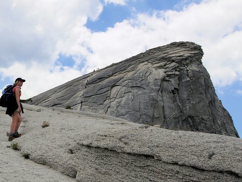 Julie reacts to climbers on cables at Half Dome, Yosemite National Park, California