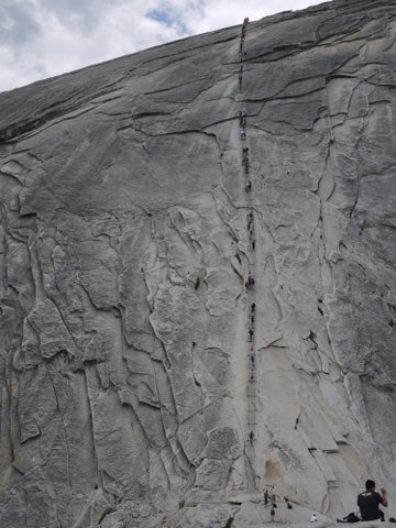 Climbers on cables at Half Dome, Yosemite National Park, California