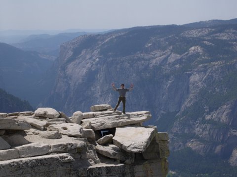 Posing on visor of Half Dome, Yosemite National Park, California
