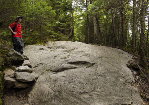 Batya admires a flat rock, Camel's Hump State Park, Chittenden & Washington Counties, Vermont