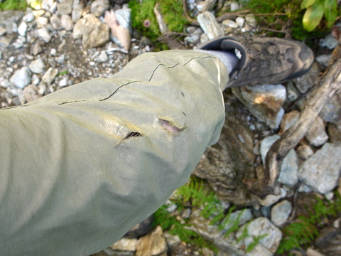 Torn hiking pants