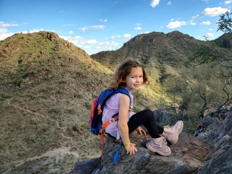 Shaina resting at the top of a hill, Phoenix Mountain Preserve, Phoenix, Arizona