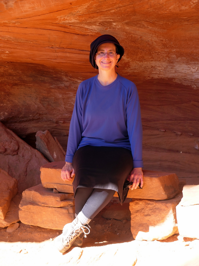 Batya sitting in Soldier Pass cave, Sedona, Arizona