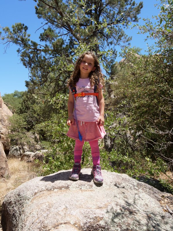 Shaina standing on a boulder